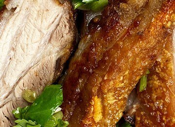 Crispy pork belly with fresh herbs and coconut vinegar dressing
